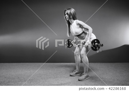Beautiful sexy athletic girl working out in gym 42286168