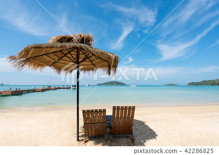 Beach Chairs and Umbrella on summer island 42286825