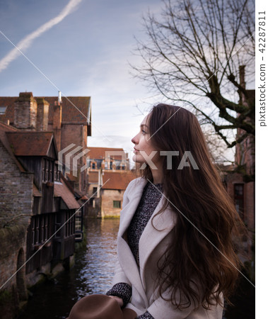 Female tourist inspired by atmosphere of old town 42287811