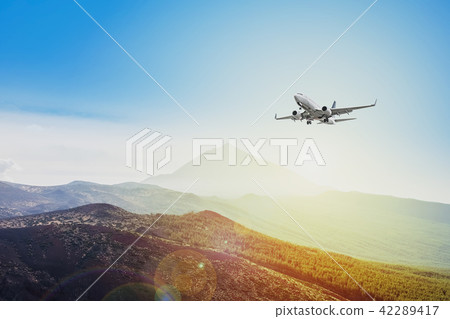 airplane flying sunset sky  travel concept 42289417