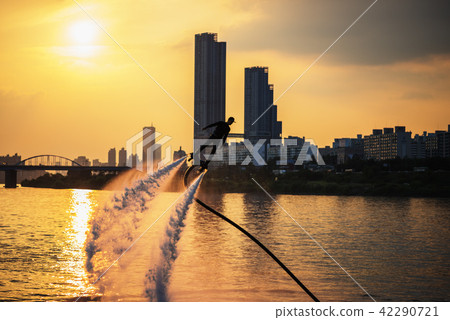 Silhouette of a fly board rider at river  42290721