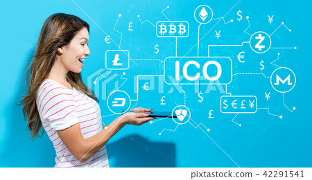 Cryptocurrency ICO theme with young woman using tablet Cryptocurrency ICO theme with young woman using tablet 42291541