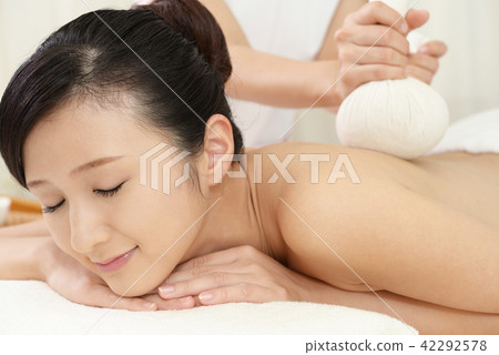 Woman receiving treatment at beauty salon Woman receiving treatment at beauty salon 42292578