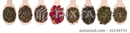 Set of different dry herbal teas in wooden spoons isolated on a white 42298754