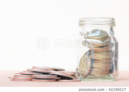 Coin in glass andthree pole range of coins. Coin in glass andthree pole range of coins. 42299227