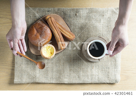 Breakfast prepared with bread and coffee Breakfast prepared with bread and coffee 42301461
