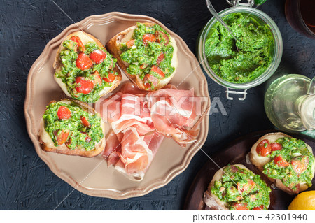 Bruschetta with fresh pesto Bruschetta with fresh pesto 42301940