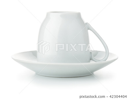 Coffee cup upside down on saucer 42304404