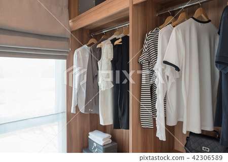 shirts hanging on rail 42306589