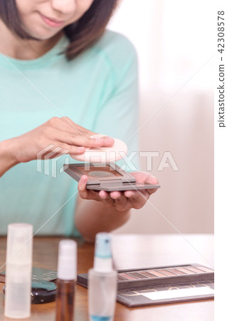 asian women make up her face in room asian women make up her face in room 42308578