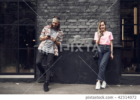 Positive male and girl using mobile 42314072