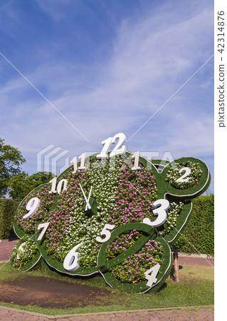 Clock design with flower in the park Clock design with flower in the park 42314876