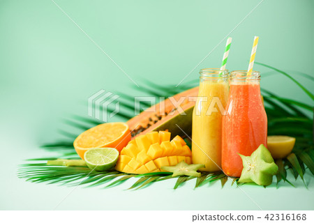Juicy papaya and pineapple, mango, orange fruit 42316168