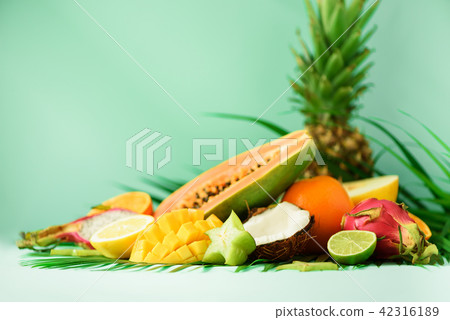 Assortment of exotic fruits on turquoise Assortment of exotic fruits on turquoise 42316189