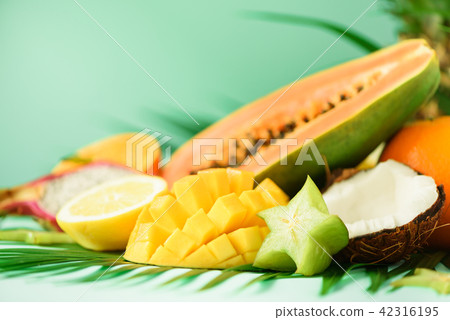 Assortment of exotic fruits on turquoise Assortment of exotic fruits on turquoise 42316195