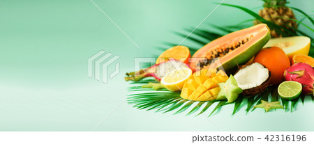 Assortment of exotic fruits on turquoise 42316196