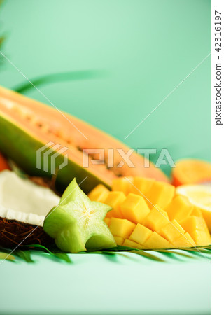Assortment of exotic fruits on turquoise Assortment of exotic fruits on turquoise 42316197