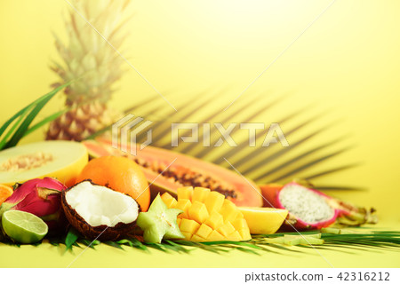 Assortment of exotic fruits on yellow background 42316212