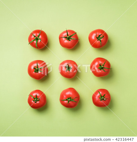 Creative pattern of red tomatos on green Creative pattern of red tomatos on green 42316447