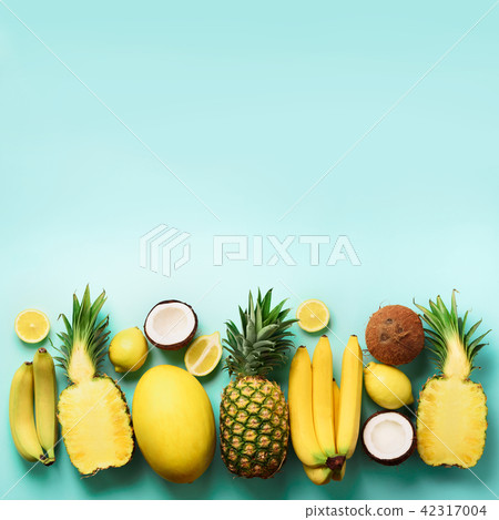 Fresh organic yellow fruits over blue background 42317004