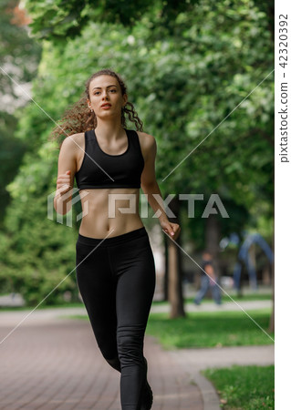 young attractive woman running young attractive woman running 42320392