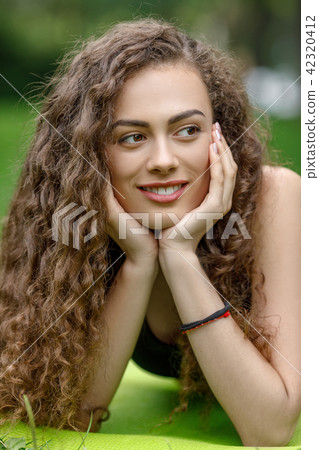 curly beautiful smiling woman 42320412