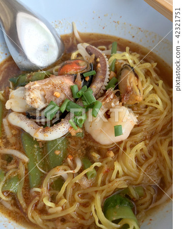 Delicious asian spicy seafood noodle soup Delicious asian spicy seafood noodle soup 42321751