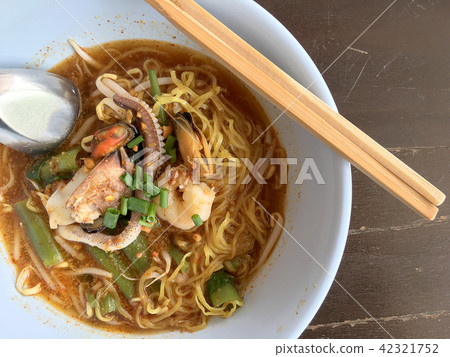 Delicious asian spicy seafood noodle soup Delicious asian spicy seafood noodle soup 42321752