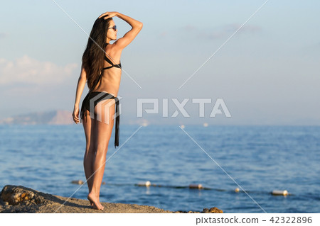 playful teen on sunset beach 42322896