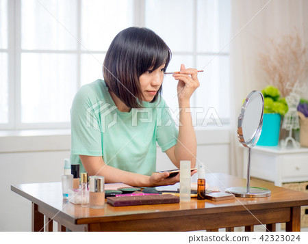 woman with makeup cosmetics woman with makeup cosmetics 42323024