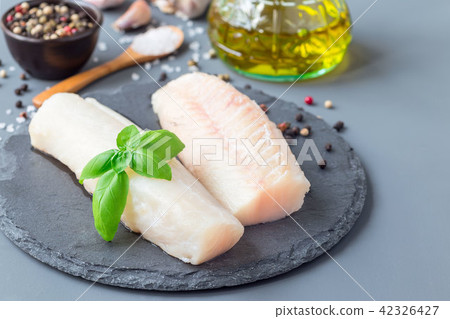 Fresh raw cod fillet with spices Fresh raw cod fillet with spices 42326427