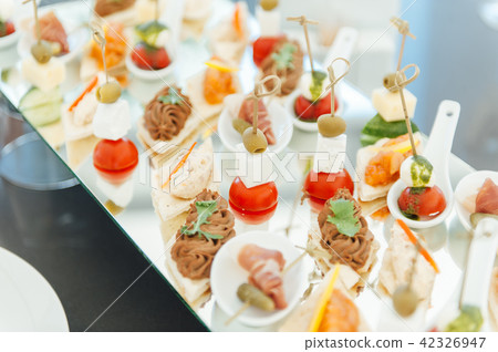 Snacks, fish and meat specialities on the buffet. Snacks, fish and meat specialities on the buffet. 42326947