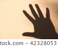 Black silhouette on white sand, open the palm of t 42328053