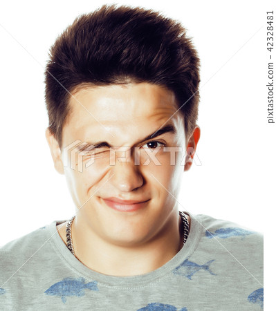 young handsome teenage hipster guy posing emotional, happy smili 42328481