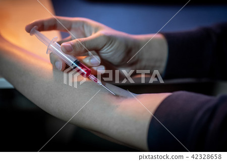 Junkie man injecting drug dose. Drug addiction Junkie man injecting drug dose. Drug addiction 42328658