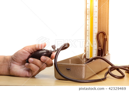 hand holding blood pressure monitor 42329469