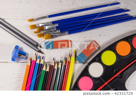 Set of drawing tools on white wooden background Set of drawing tools on white wooden background 42331729