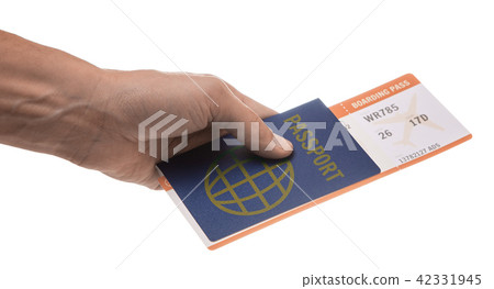 Man holds passport and plane ticket in his hand 42331945