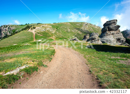 Road through mountains 42332117