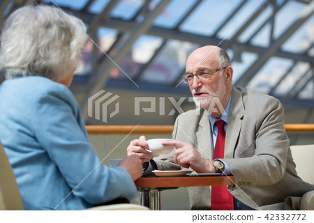 Senior couple drink coffee Senior couple drink coffee 42332772