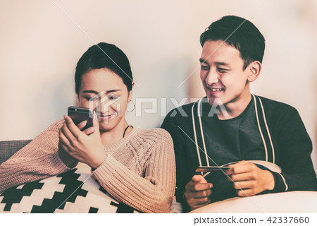 A wife who intercepts a smartphone A wife who intercepts a smartphone 42337660