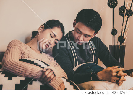Husband watching over sleeping wife Husband watching over sleeping wife 42337661