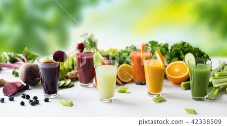 glasses with different fruit or vegetable juices glasses with different fruit or vegetable juices 42338509