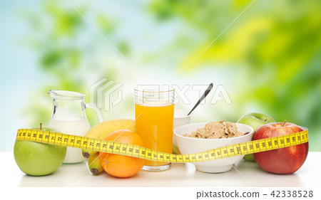 breakfast food and measuring tape on table breakfast food and measuring tape on table 42338528