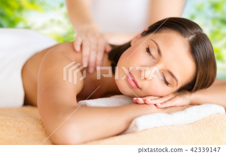 close up of beautiful woman having massage at spa 42339147