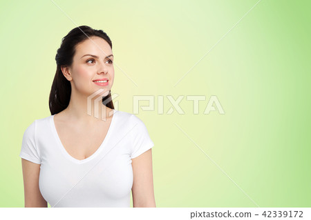 happy woman in white t-shirt over lime green 42339172