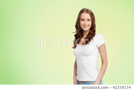 happy slim woman in white t-shirt over lime green 42339174