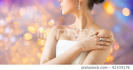 close up of beautiful woman with finger ring 42339176