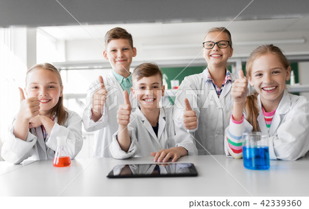 happy kids showing thumbs up at school laboratory happy kids showing thumbs up at school laboratory 42339360