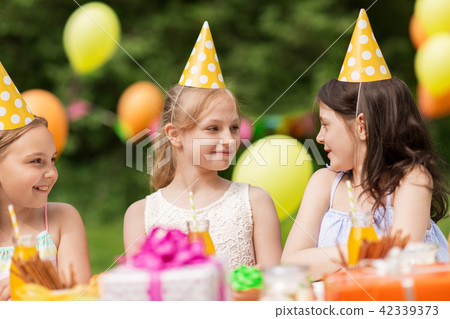 happy girls on birthday party at summer garden 42339373